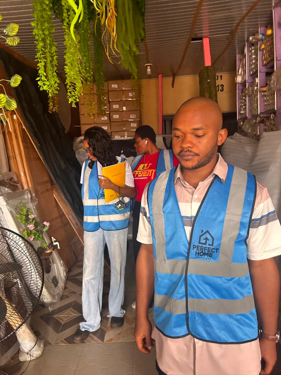 Interior design academy students in safety vests during a construction site visit in Enugu