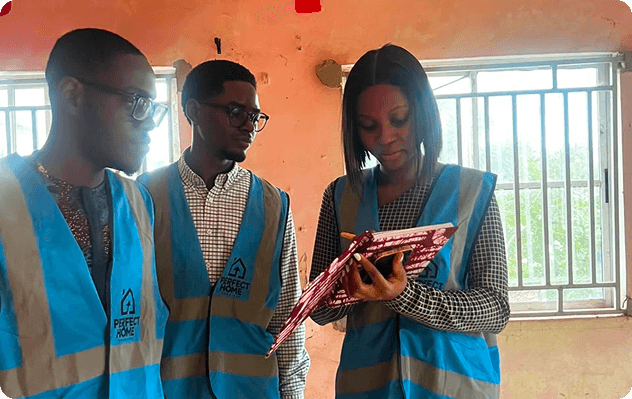 Students in branded vests during a practical interior design session