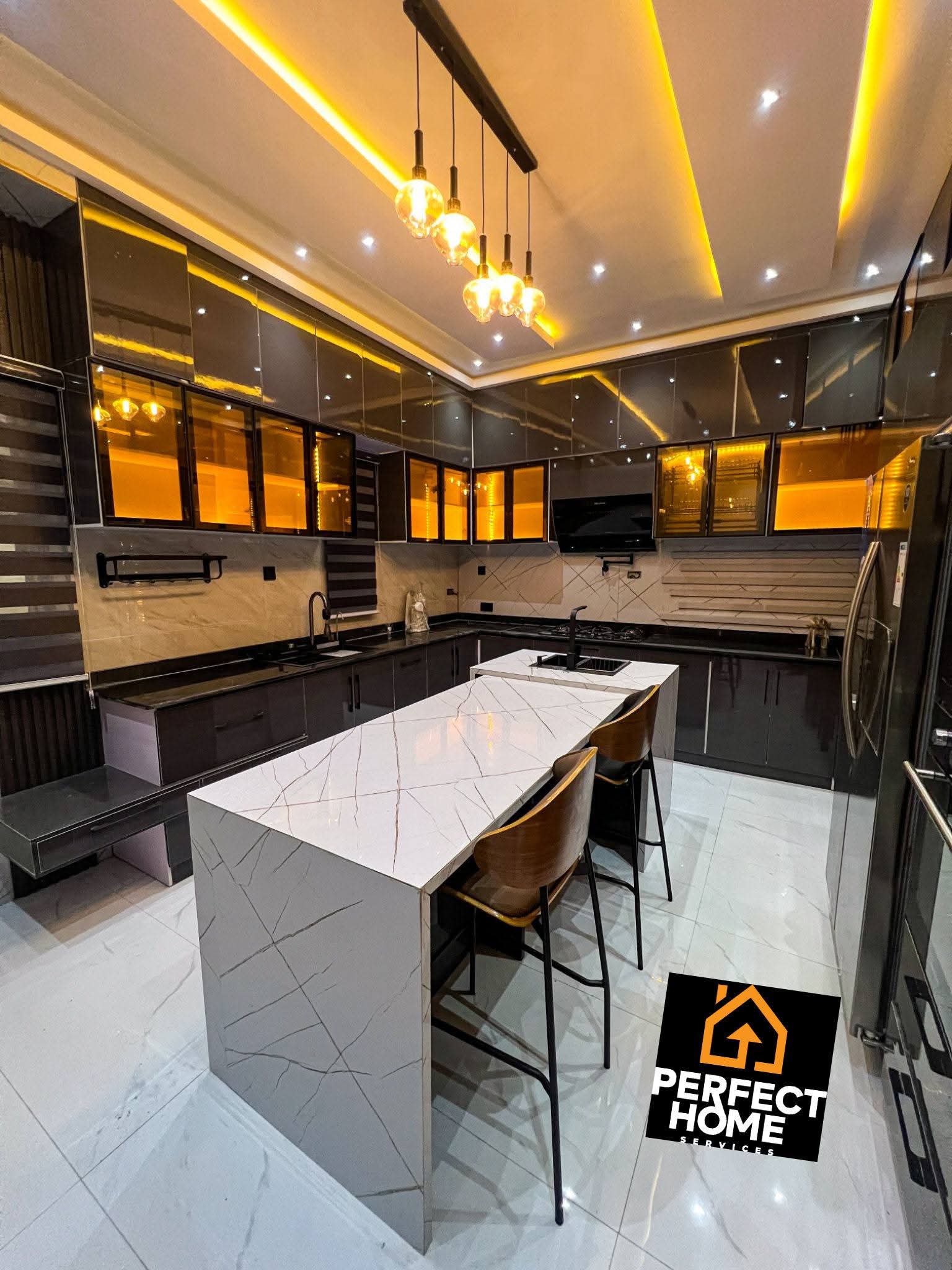 Smart technology integration in a modern kitchen with sleek cabinetry, island, lighting, and appliances.